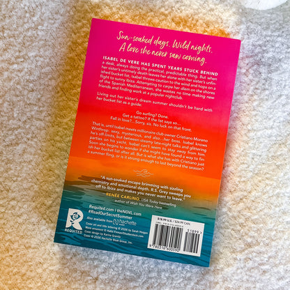 Back cover of a book with a colorful gradient design on a textured surface
