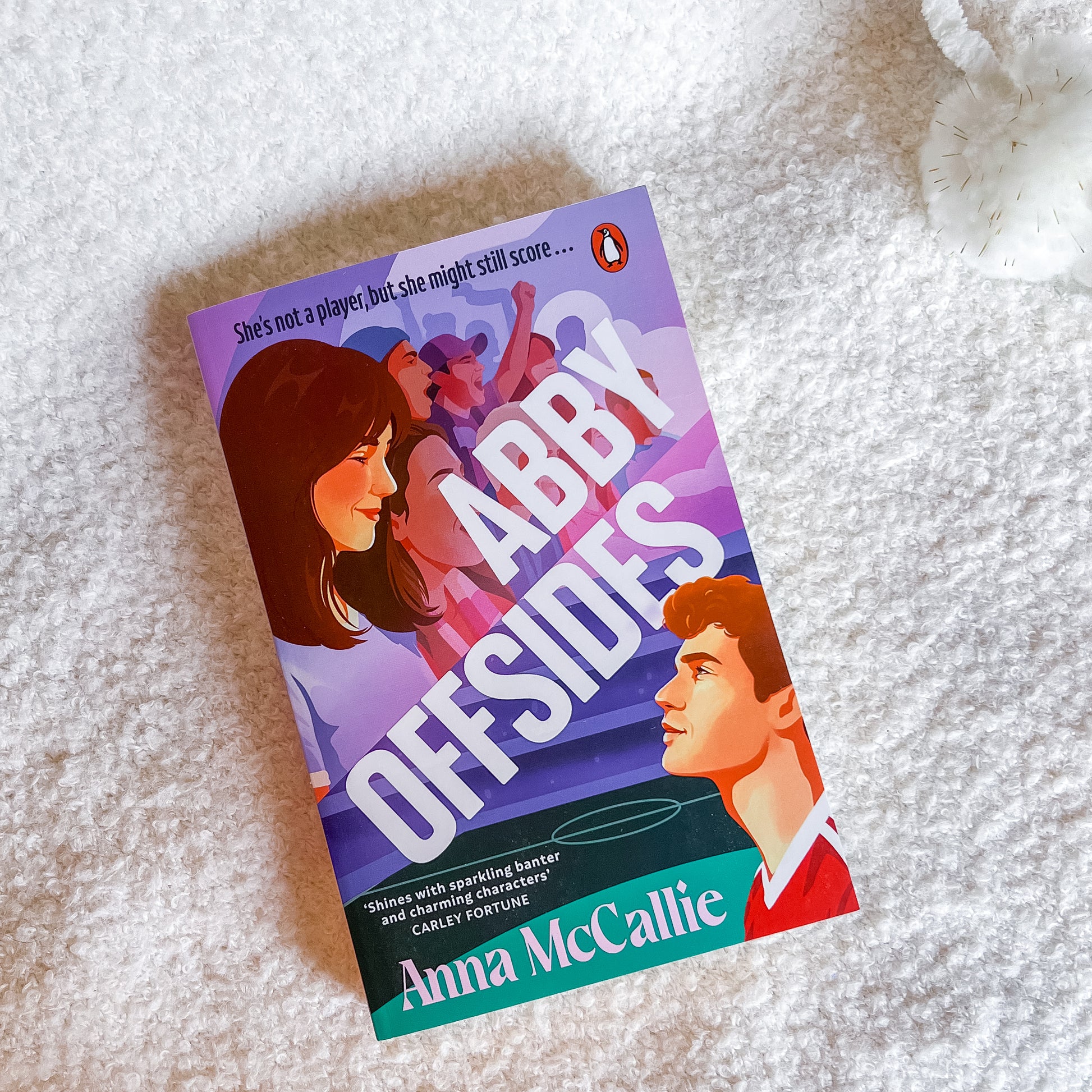 Book titled 'Abby Offsides' by Anna McCallie on a textured surface