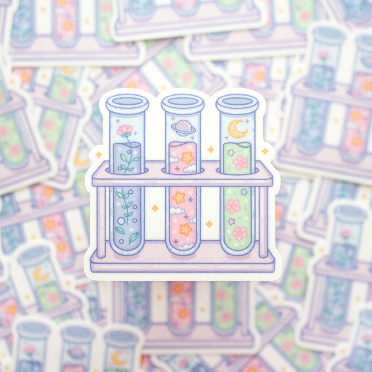 Pastel-colored test tubes with floral designs on a matching background