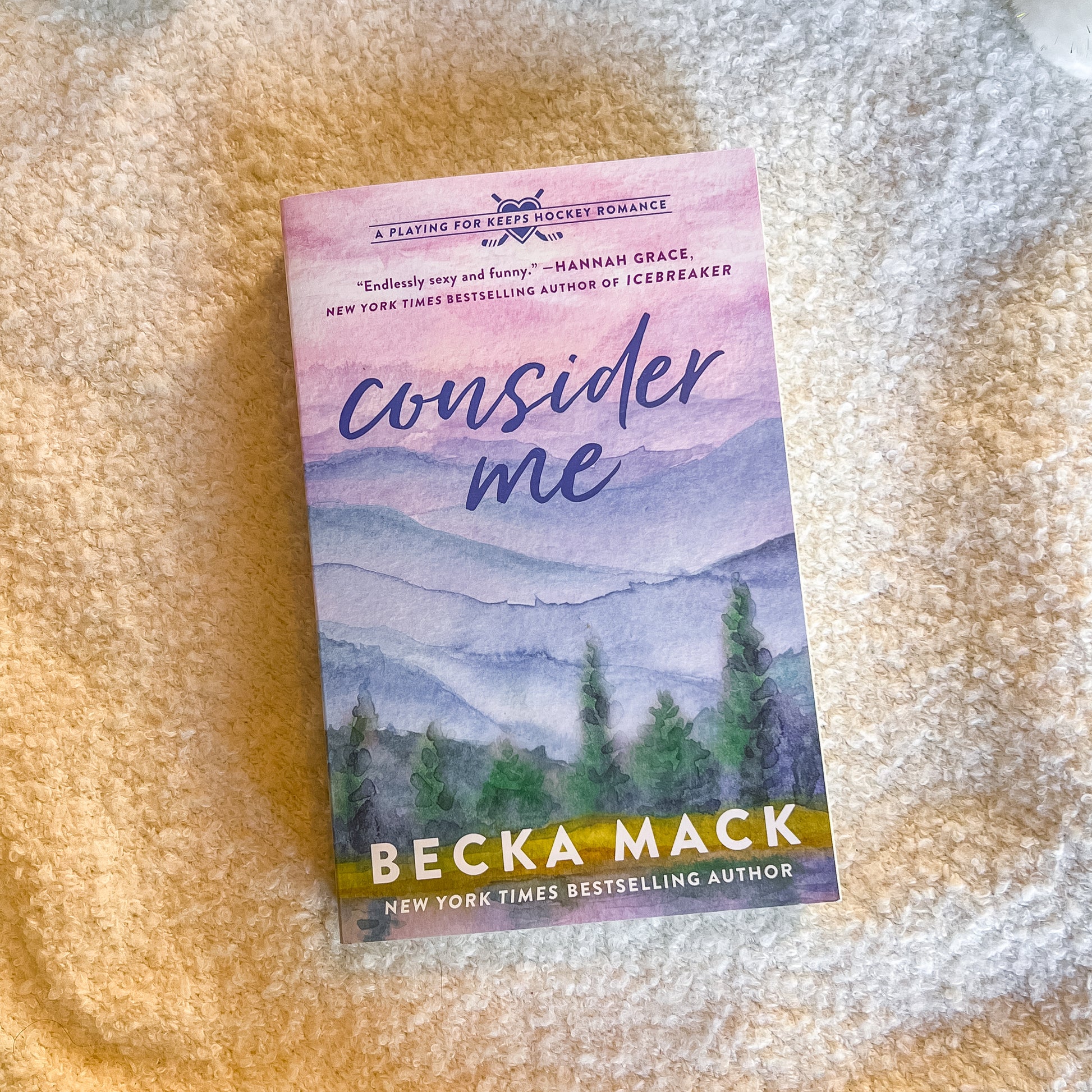Book titled 'Consider Me' by Becca Mack on a textured surface