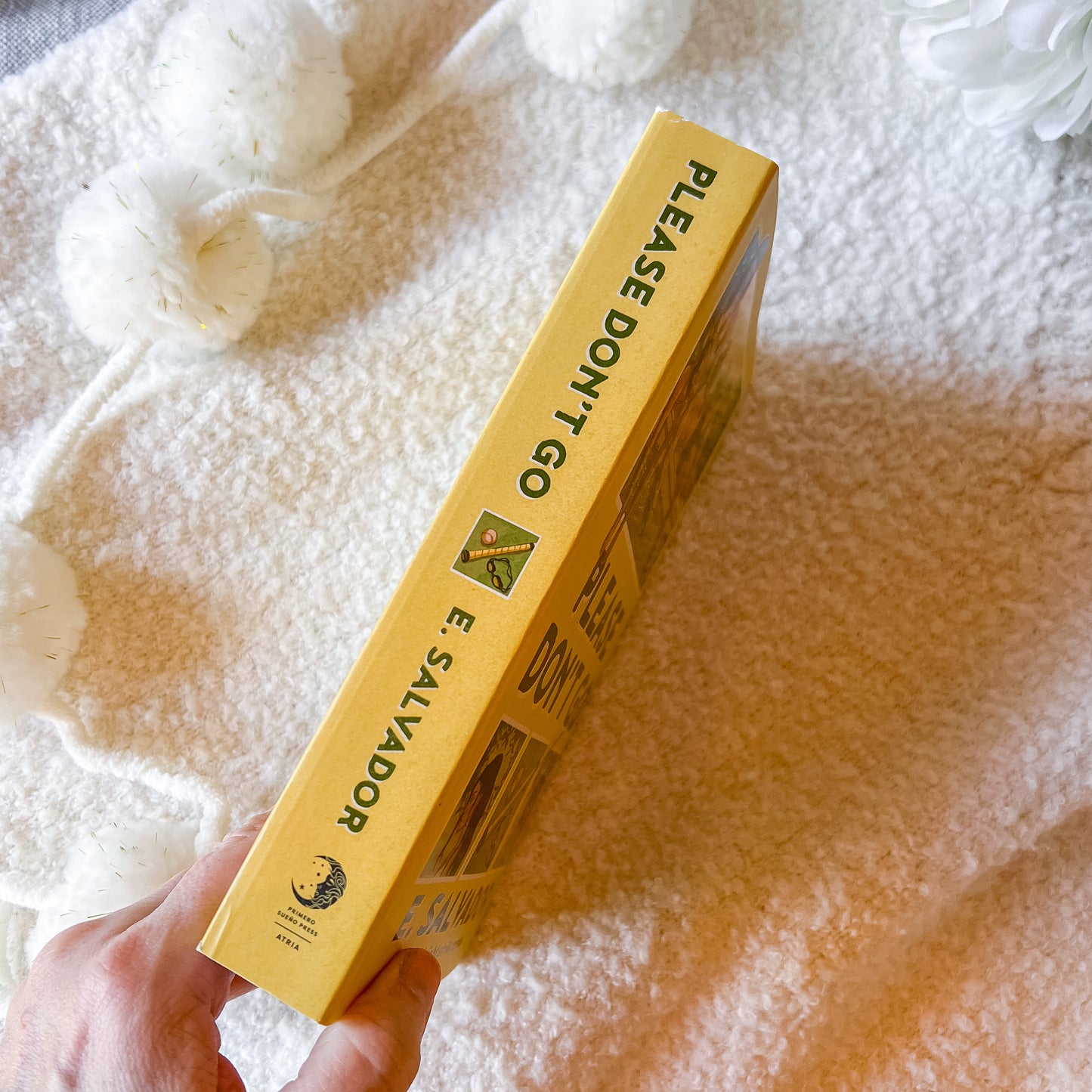 Book spine of 'Please Don't Go' by E. Salvador on a white background