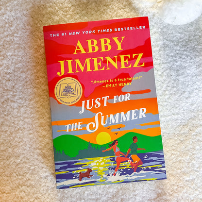 Book titled 'Just for the Summer' by Abby Jimenez on a textured surface