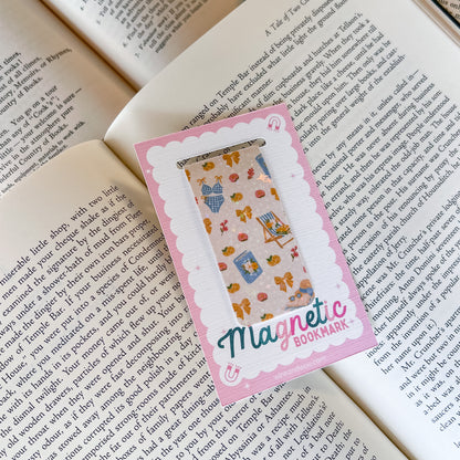 Magnetic bookmark with colorful design on an open book