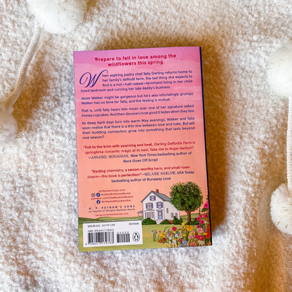 The back cover of the book, displayed flat on a textured white fabric background.