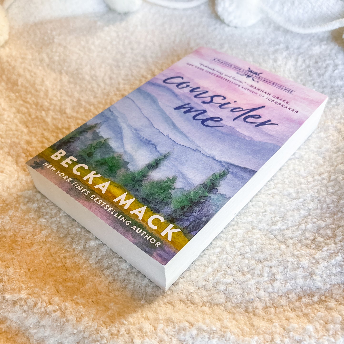 Book titled 'Consider Me' by Becca Mack on a textured surface