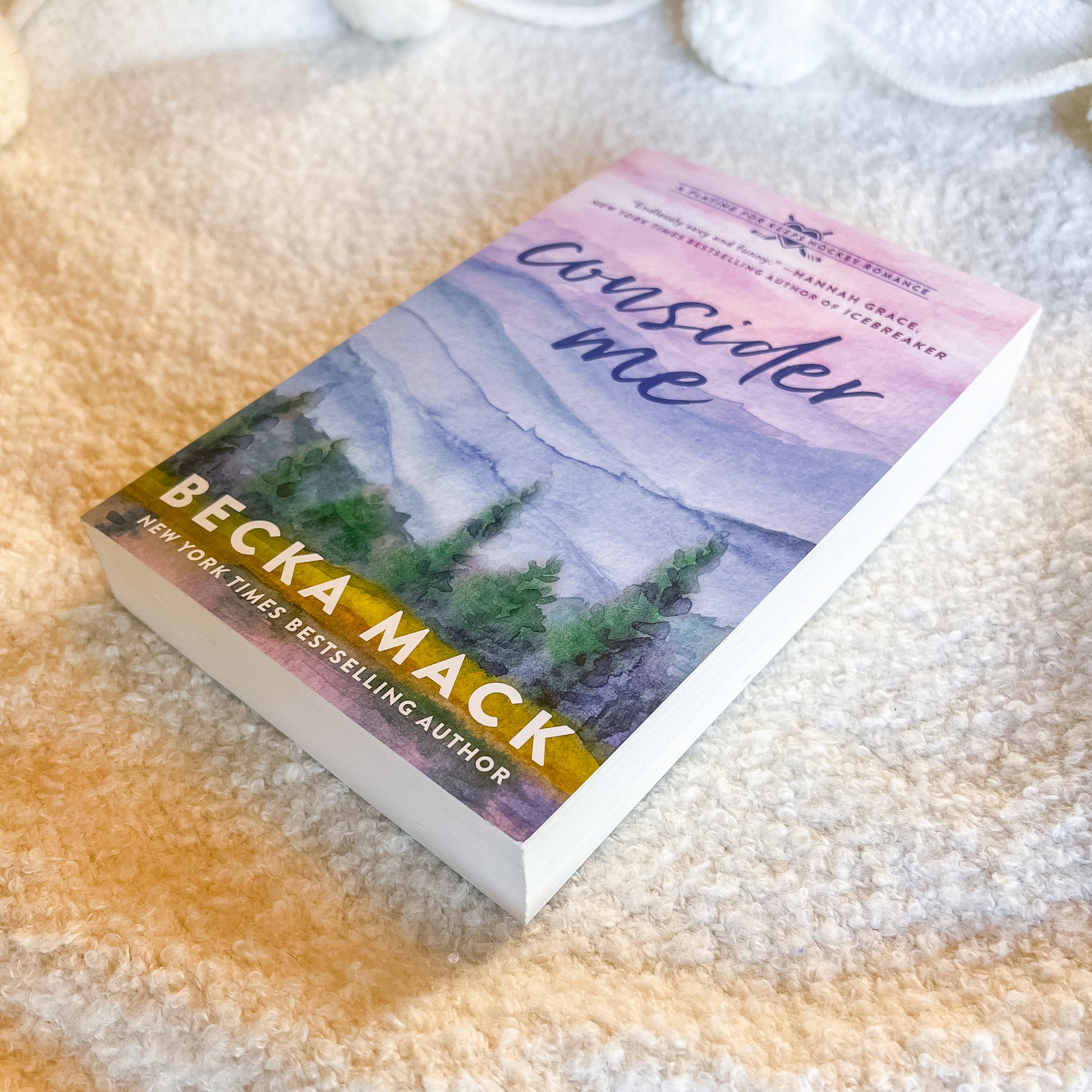 Book titled 'Consider Me' by Becca Mack on a textured surface