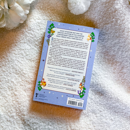The back cover of a children's book titled 'Sticky Situations' is shown flat-lay on a soft white textured blanket, with a white flower prop in the top-left corner.