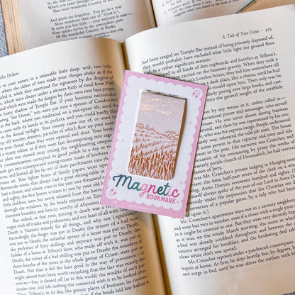 Magnetic bookmark with a field design on an open book