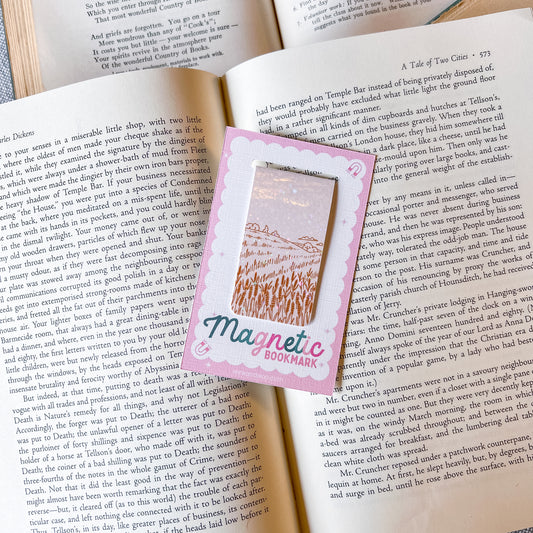 Magnetic bookmark with a field design on an open book