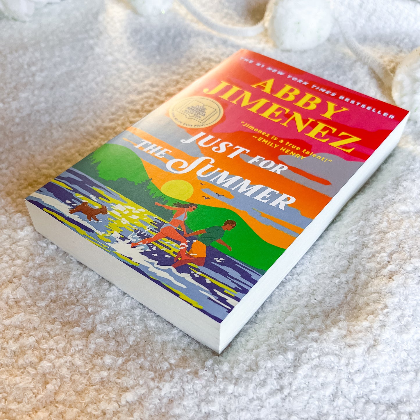 Book titled 'Just for Summer' by Abby Jimenez on a textured surface