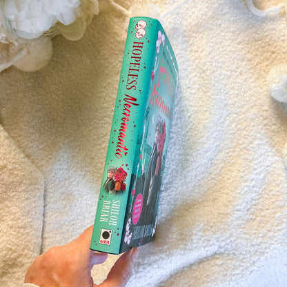 Book titled 'Hopeless Mermaid' by Shilpi Balak held on a soft, light-colored surface.
