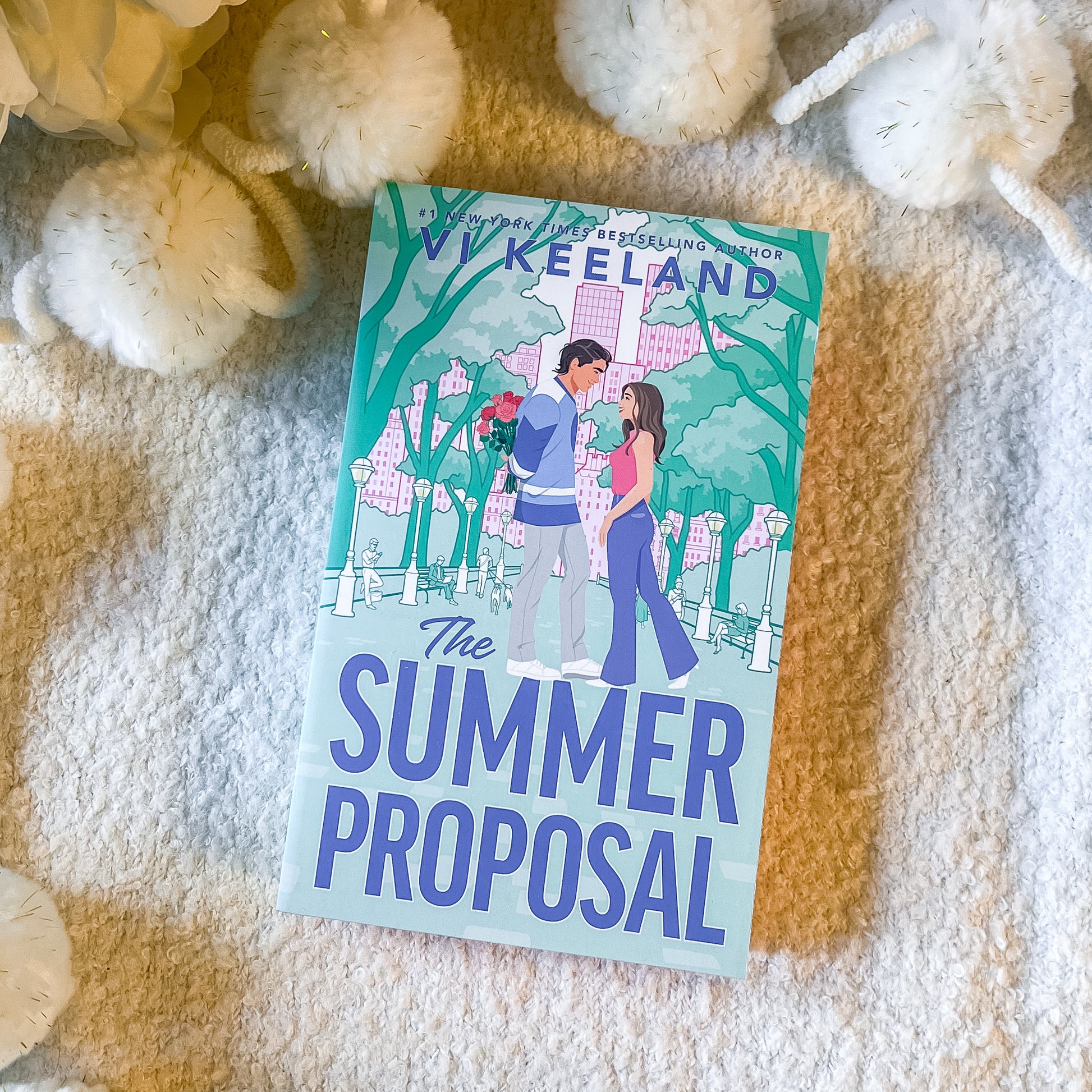 "The summer proposal" by Vi Keeland book on a soft white background.