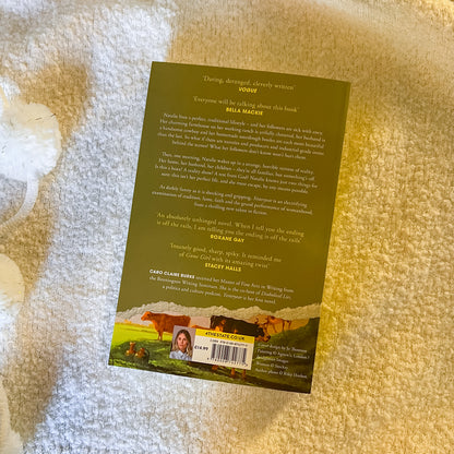 Book cover with text and images of cows on a textured surface