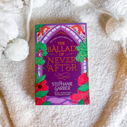 Book titled 'The Ballad of Never After' by Stephanie Garber on a textured surface.
