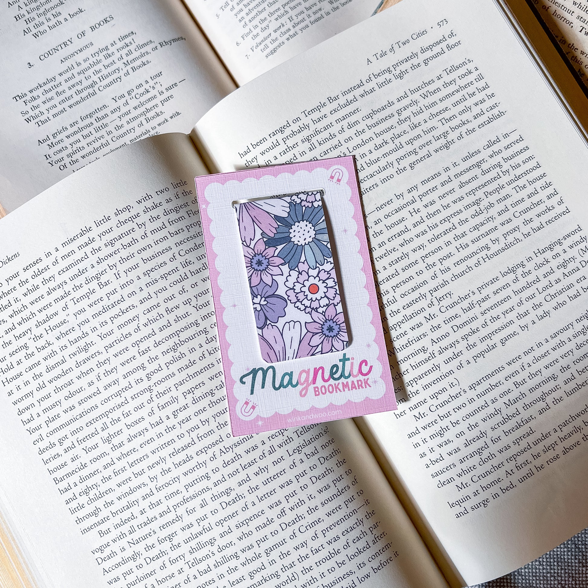 Floral magnetic bookmark on an open book
