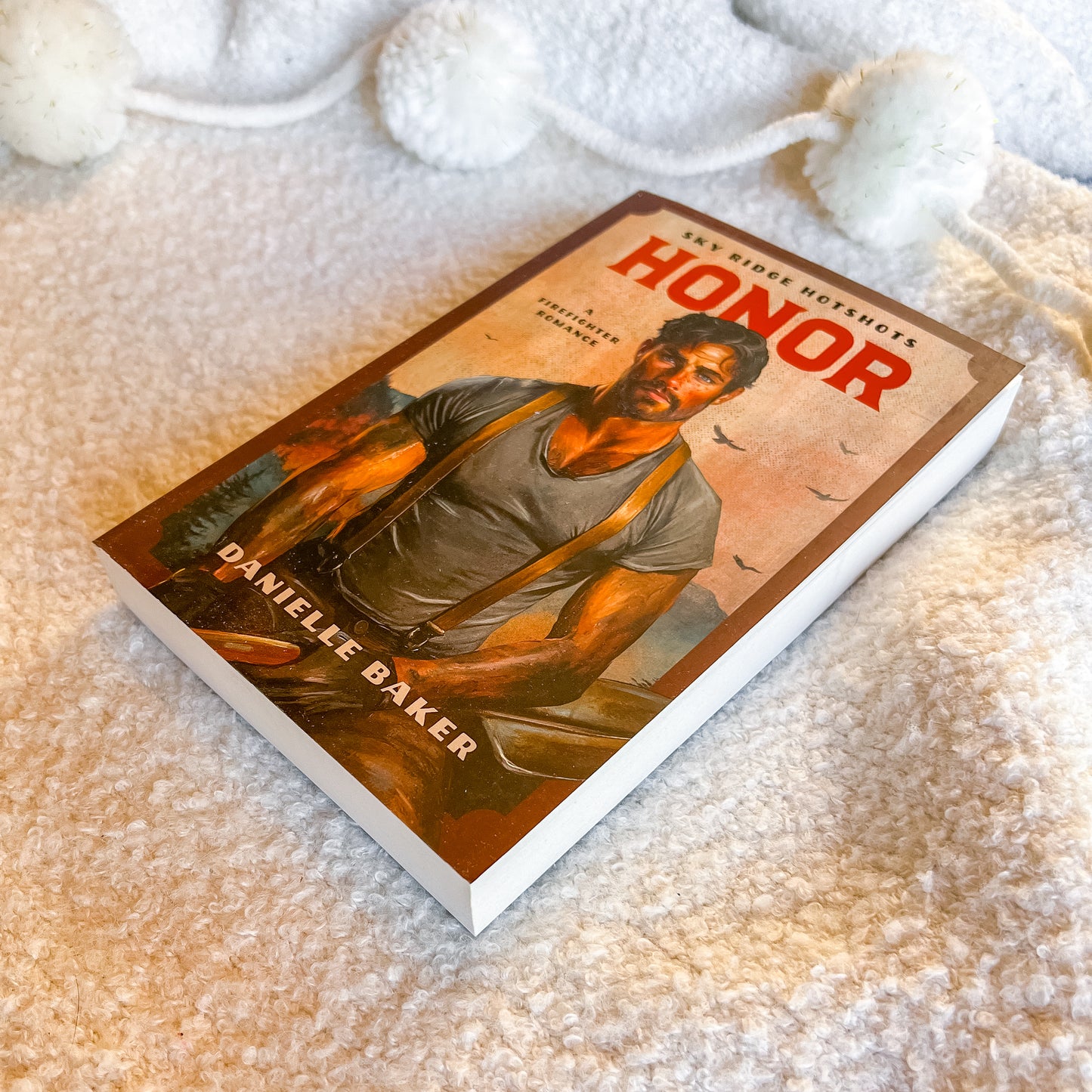 Book titled 'Honor' by Danielle Baker on a textured surface