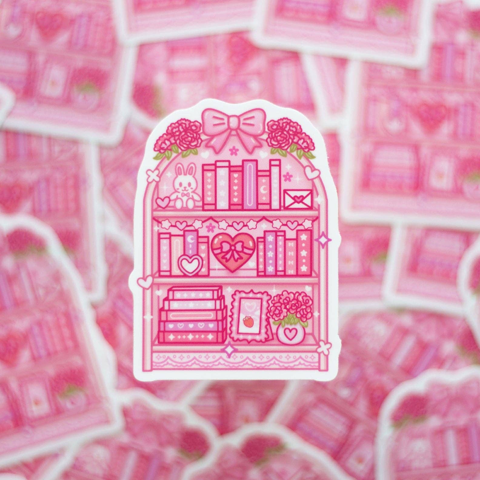 Pink sticker with a bookshelf design on a pink background