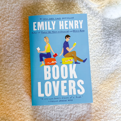 Book cover of 'Book Lovers' by Emily Henry on a textured surface