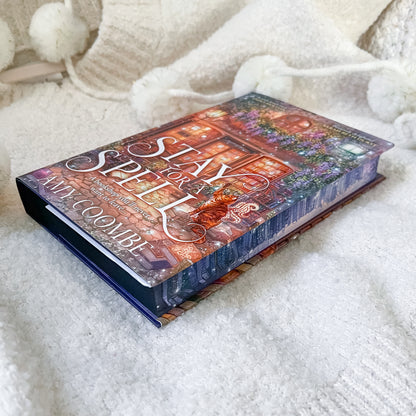 Book titled 'Stay Spell' by Amy Coe on a soft white surface