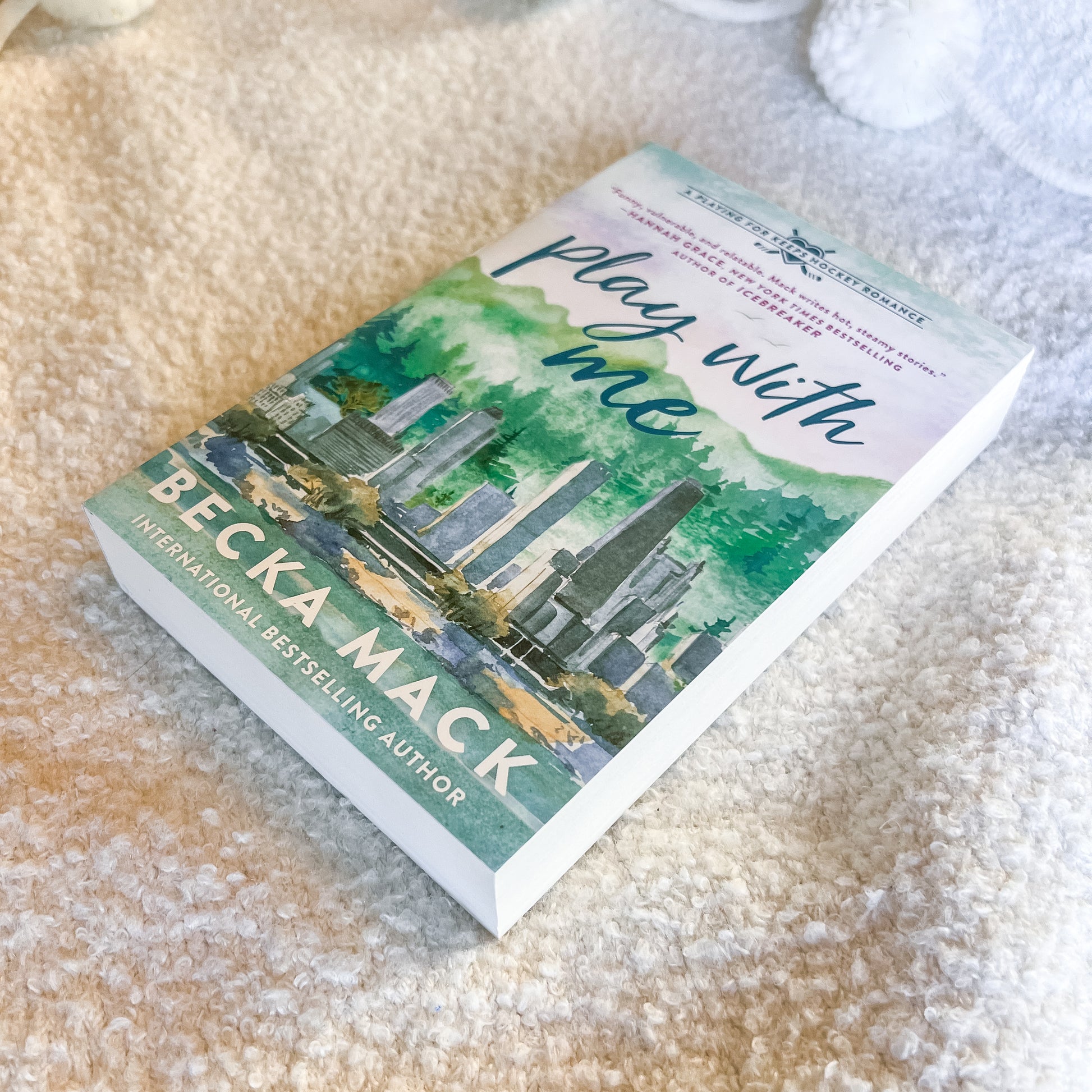 Book titled 'Play with Me' by Becka Mack on a textured surface