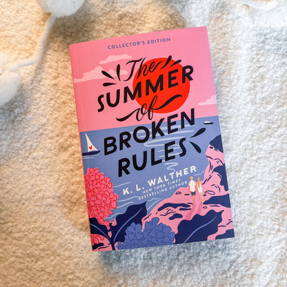 The Summer of Broken Rules Collector's Edition book by K. L. Walther, displayed diagonally on a soft beige textured blanket.