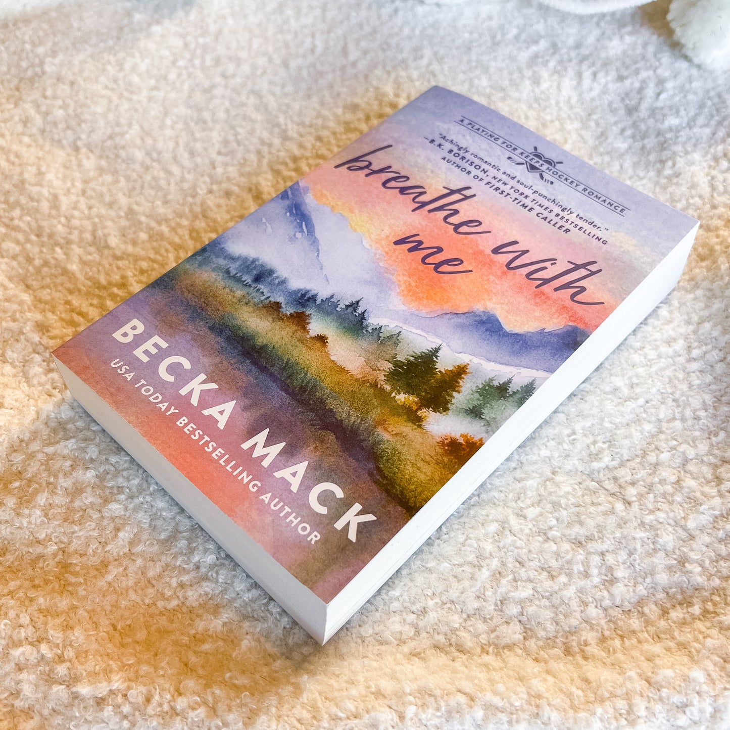 Book titled 'Breathe with Me' by Becka Mack on a textured surface