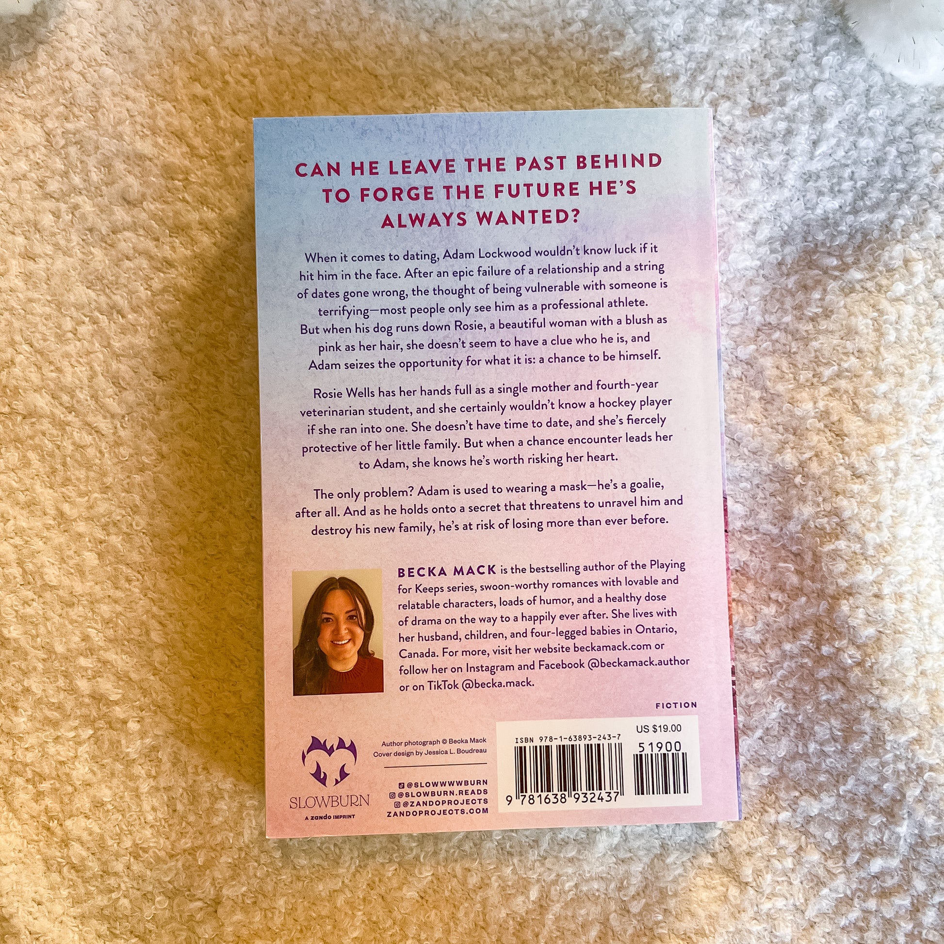 Back cover of a book with text and a barcode on a textured surface