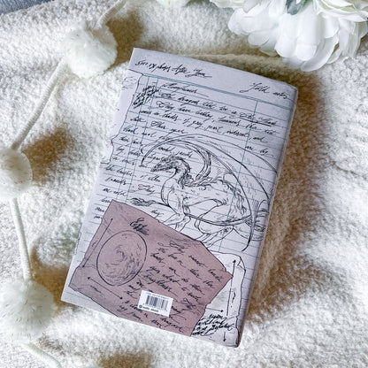 Book with dragon illustration on a soft surface