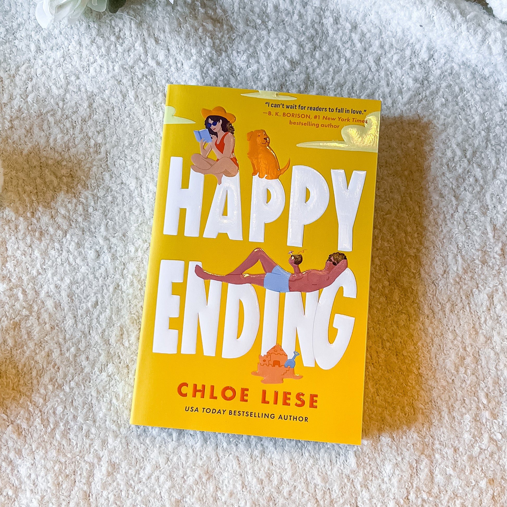 Happy Ending book by Chloe Liese on a light textured background