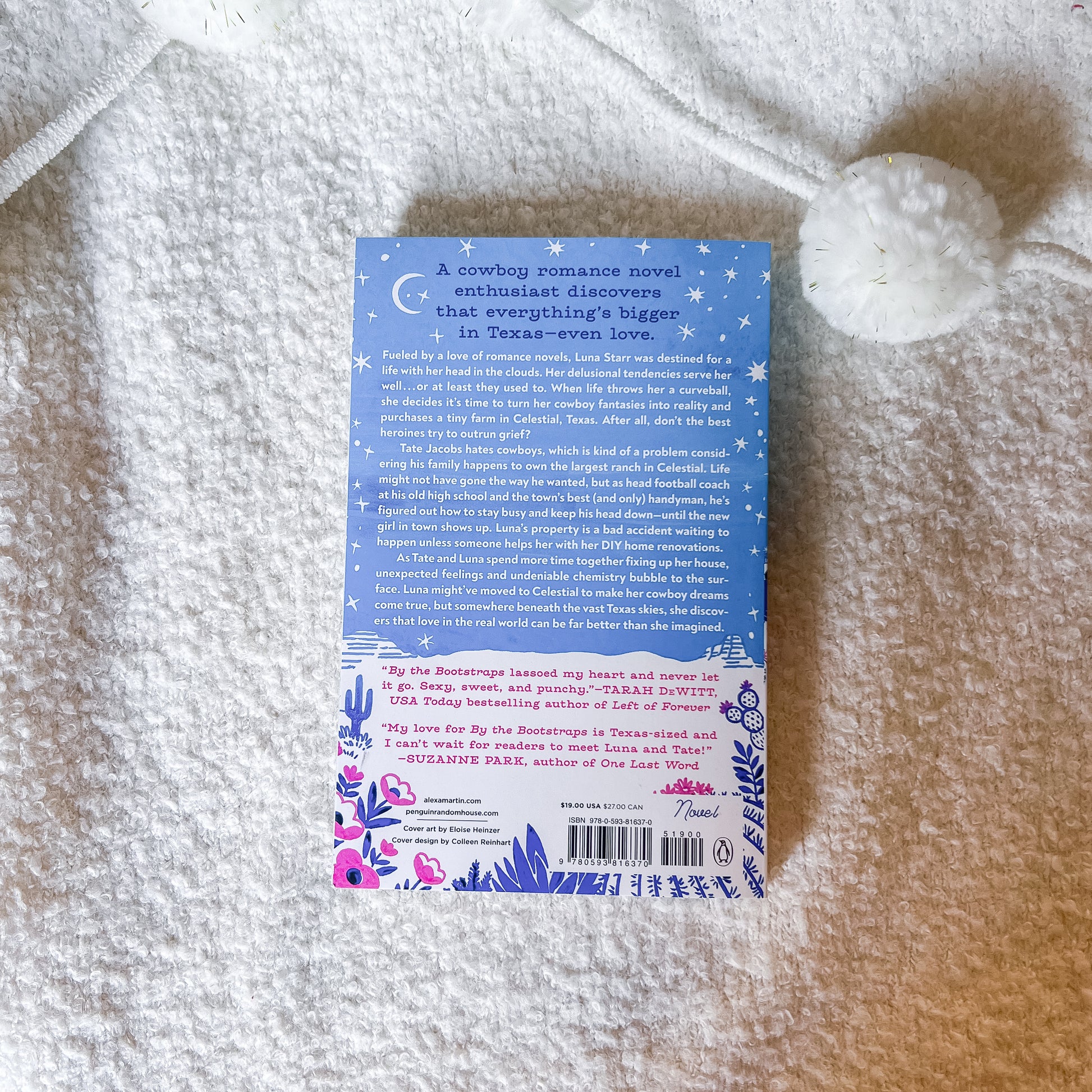 Book cover with text and graphics on a textured surface