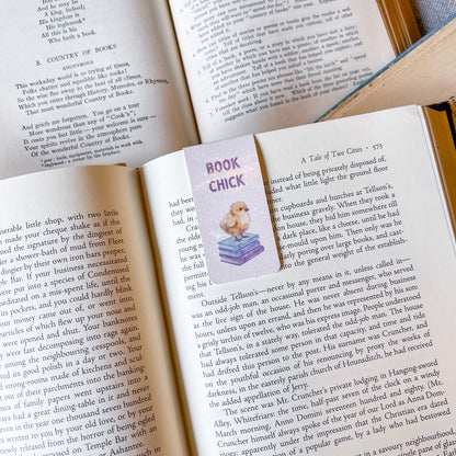 Open book with a bookmark titled 'Book Chick' featuring a cartoon chick on top of books.