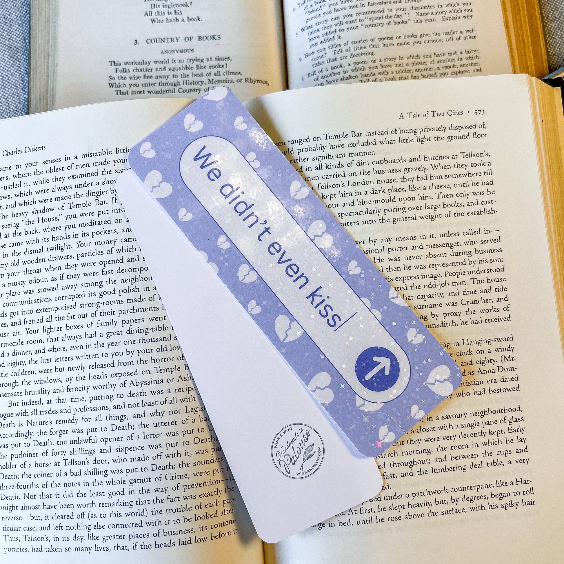 Bookmark with 'We didn't even kiss' text on a book