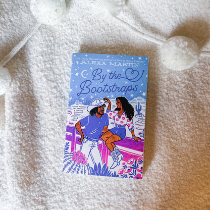 Book titled 'By the Bootstraps' by Alexa Martin on a textured surface