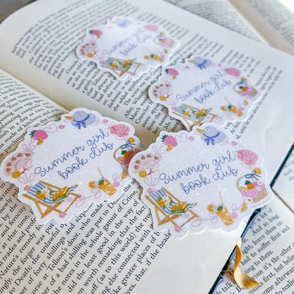 Decorative bookmarks with 'Summer girl book club' design on an open book.