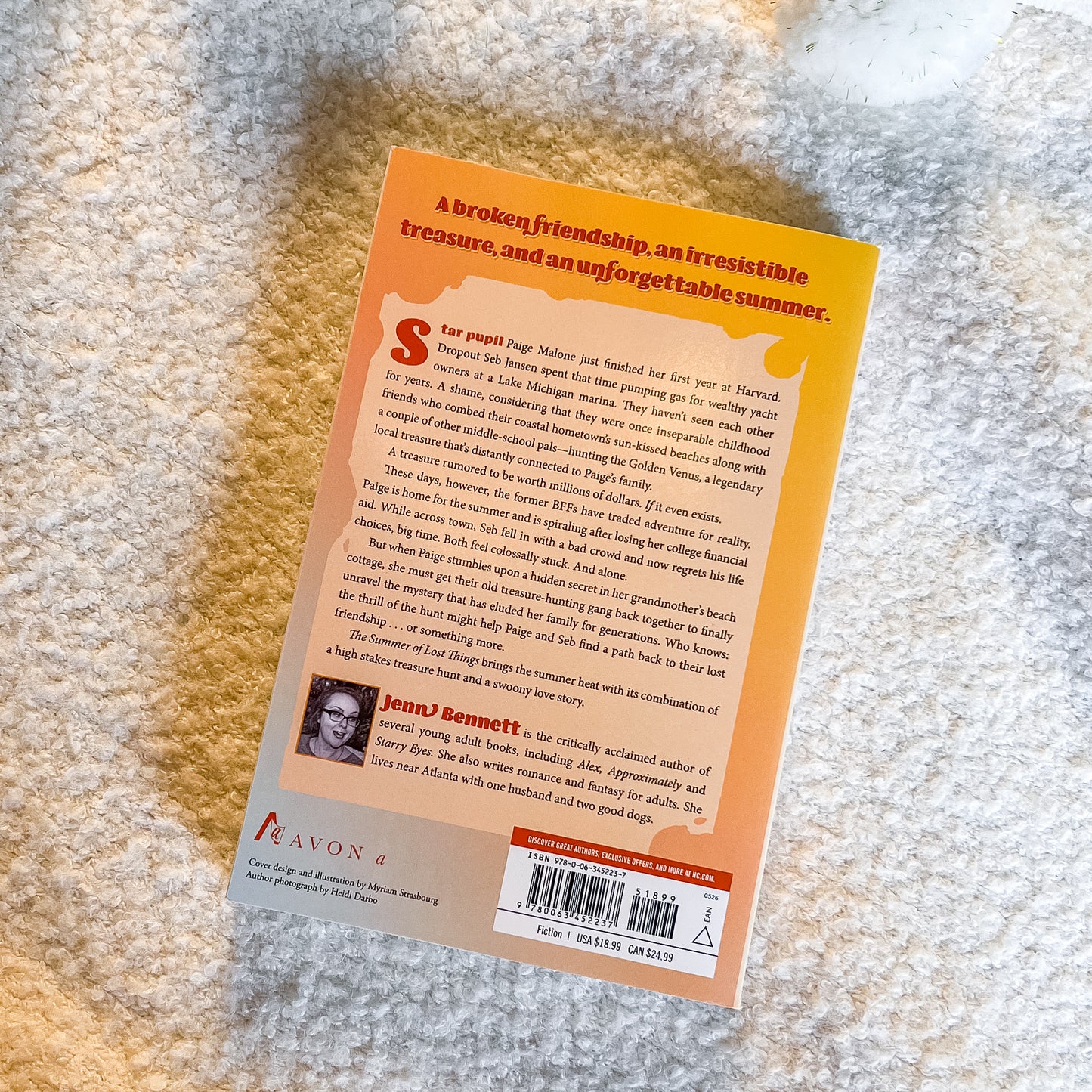Book back cover with text and a barcode on a textured surface