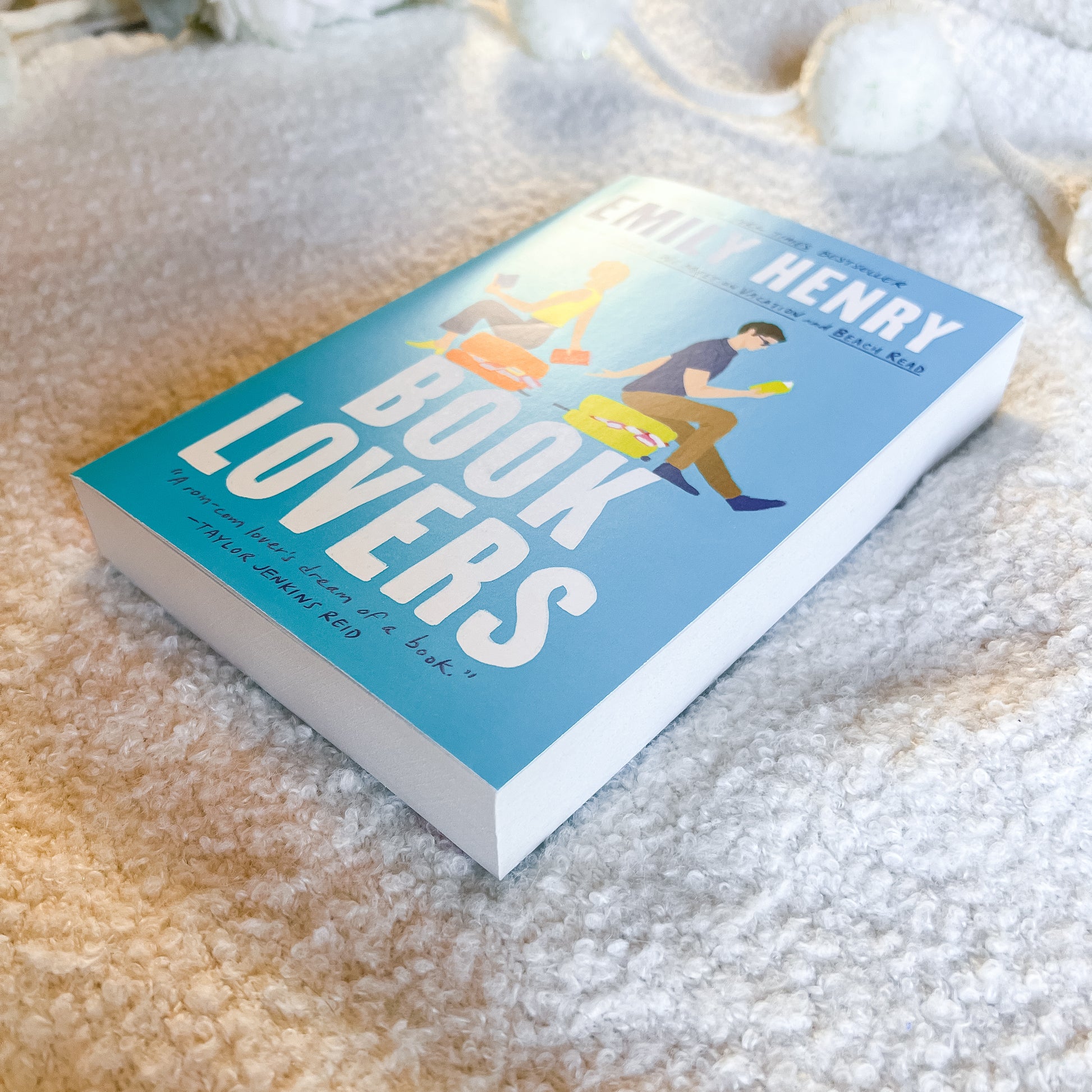 Book titled 'Book Lovers' by Henry on a textured surface