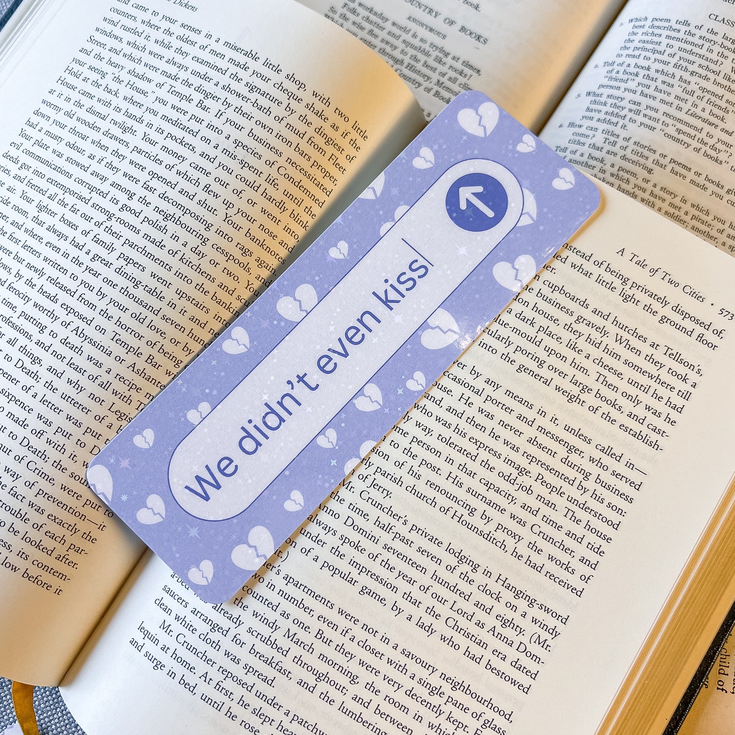 Bookmark with 'We didn't even kiss' text on a book