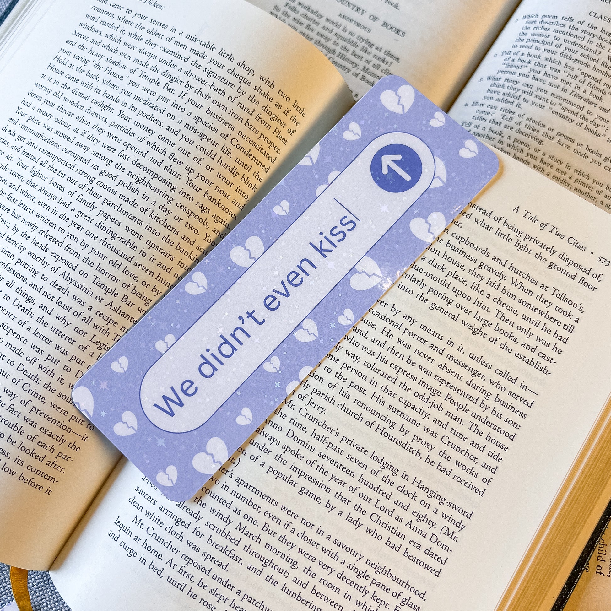 Bookmark with 'We didn't even kiss' text on a book
