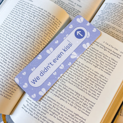 Bookmark with 'We didn't even kiss' text on a book