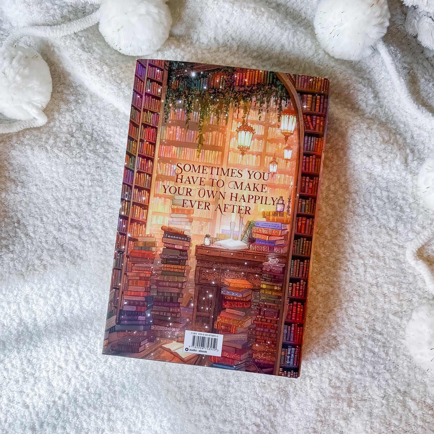 Book with a colorful cover of a library on a white textured surface