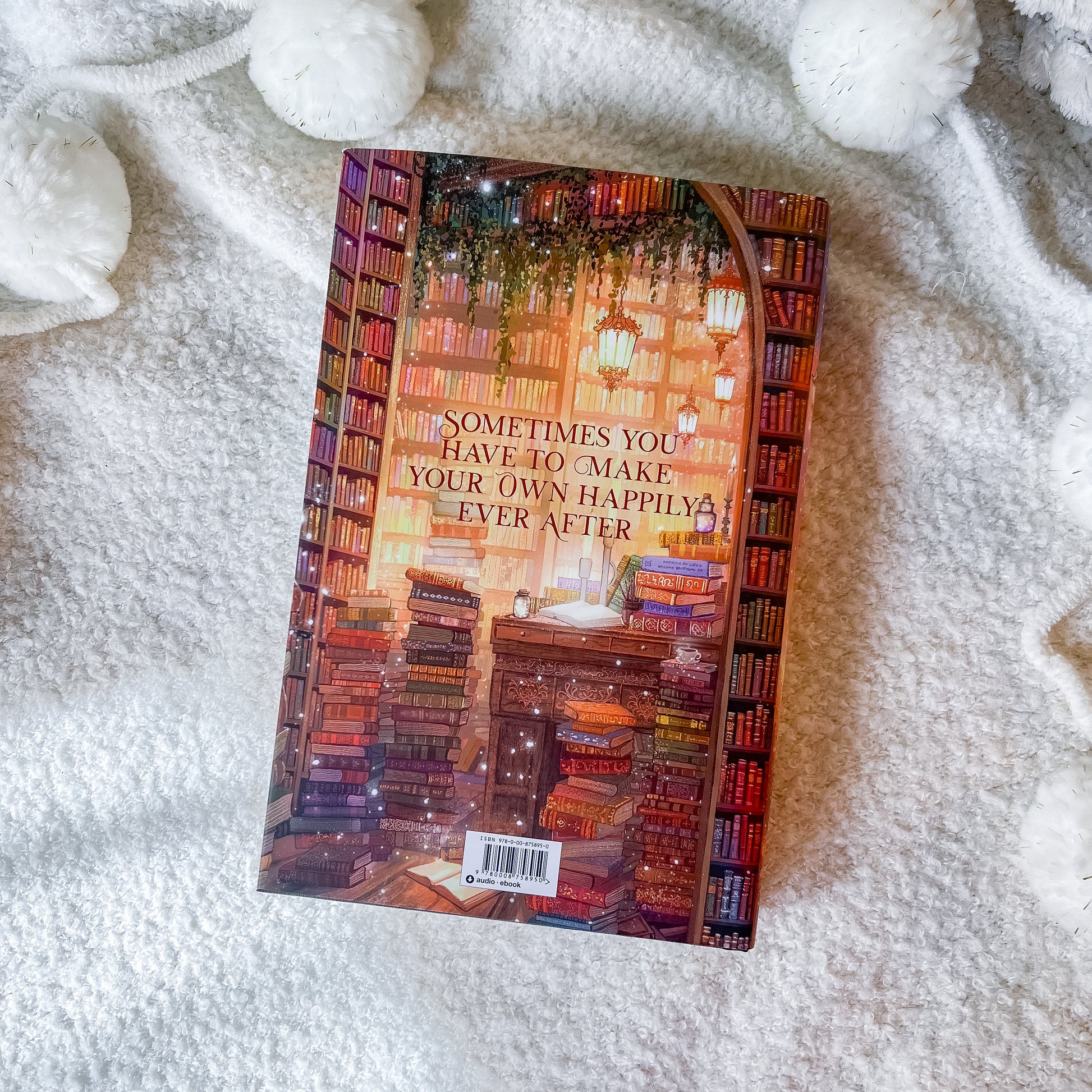 Book with a colorful cover of a library on a white textured surface