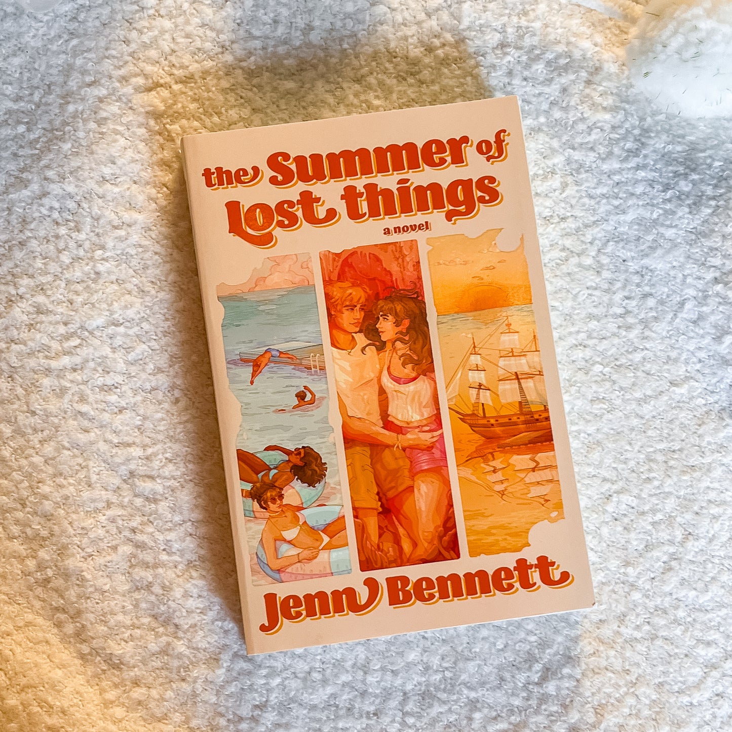 Book titled 'The Summer of Lost Things' by Jenny Bennett on a textured surface