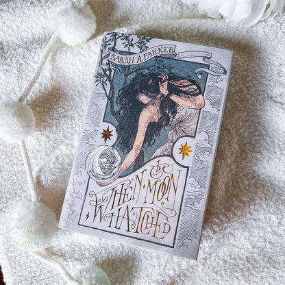 Book titled 'When Moon Hatched' by Sarah A. Parker on a textured white surface.