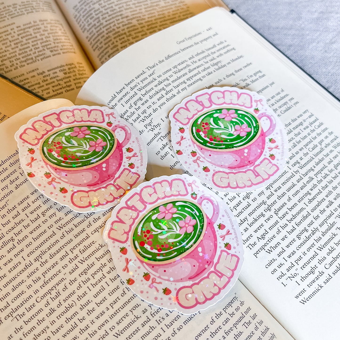 Three 'Matcha Green' themed stickers on an open book
