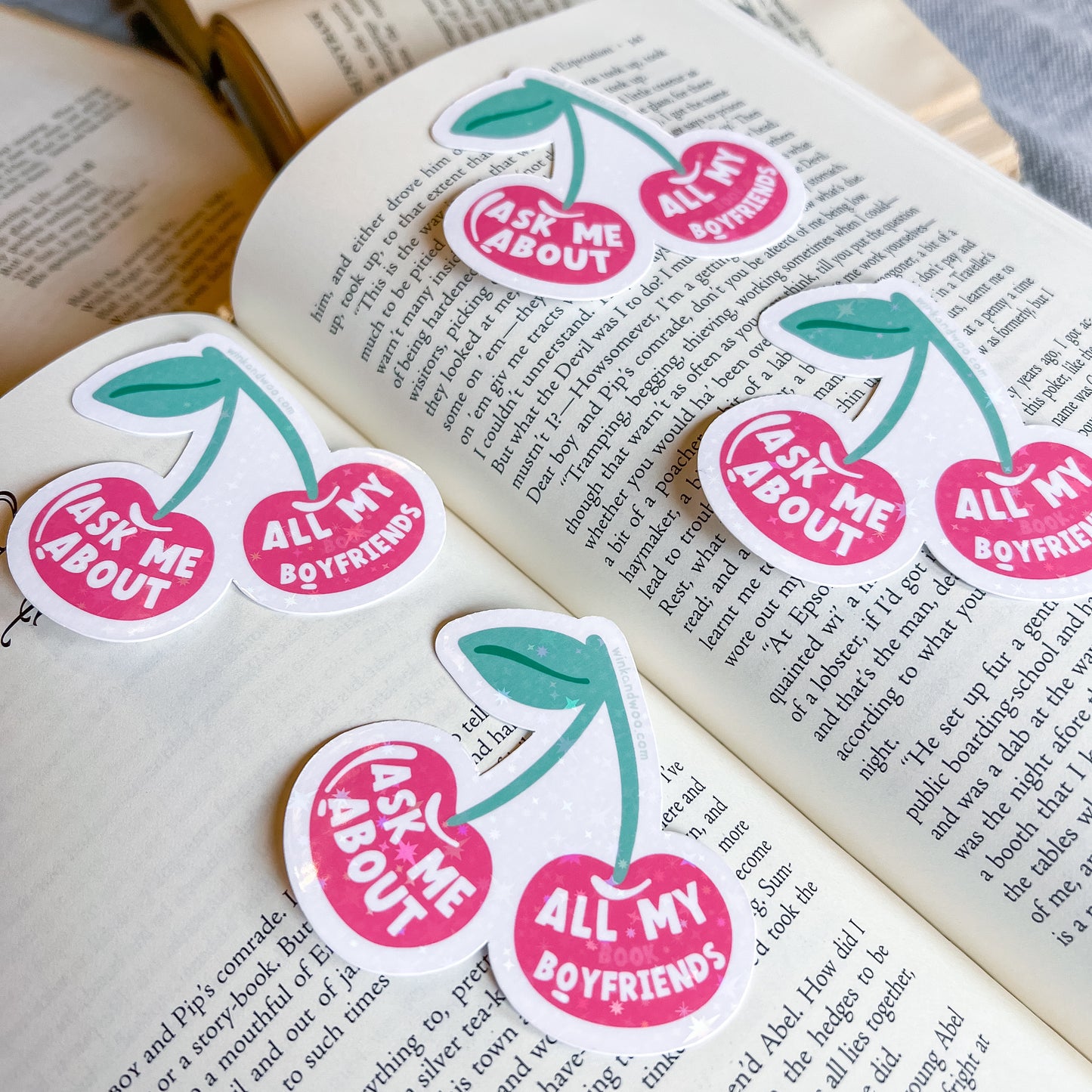 Cherry-themed stickers with text on an open book