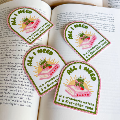 Four identical stickers with a strawberry, and book on an open book background.