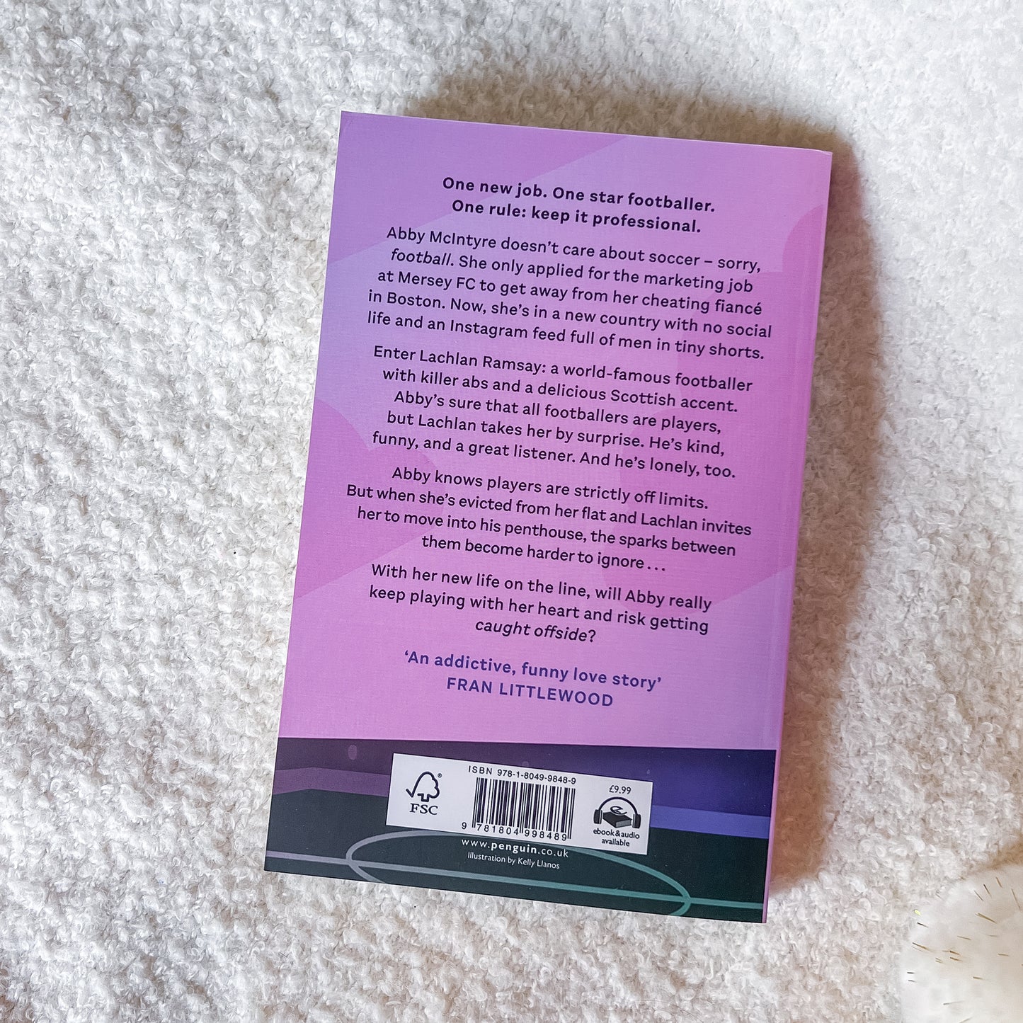 Purple book back cover with text on a textured surface