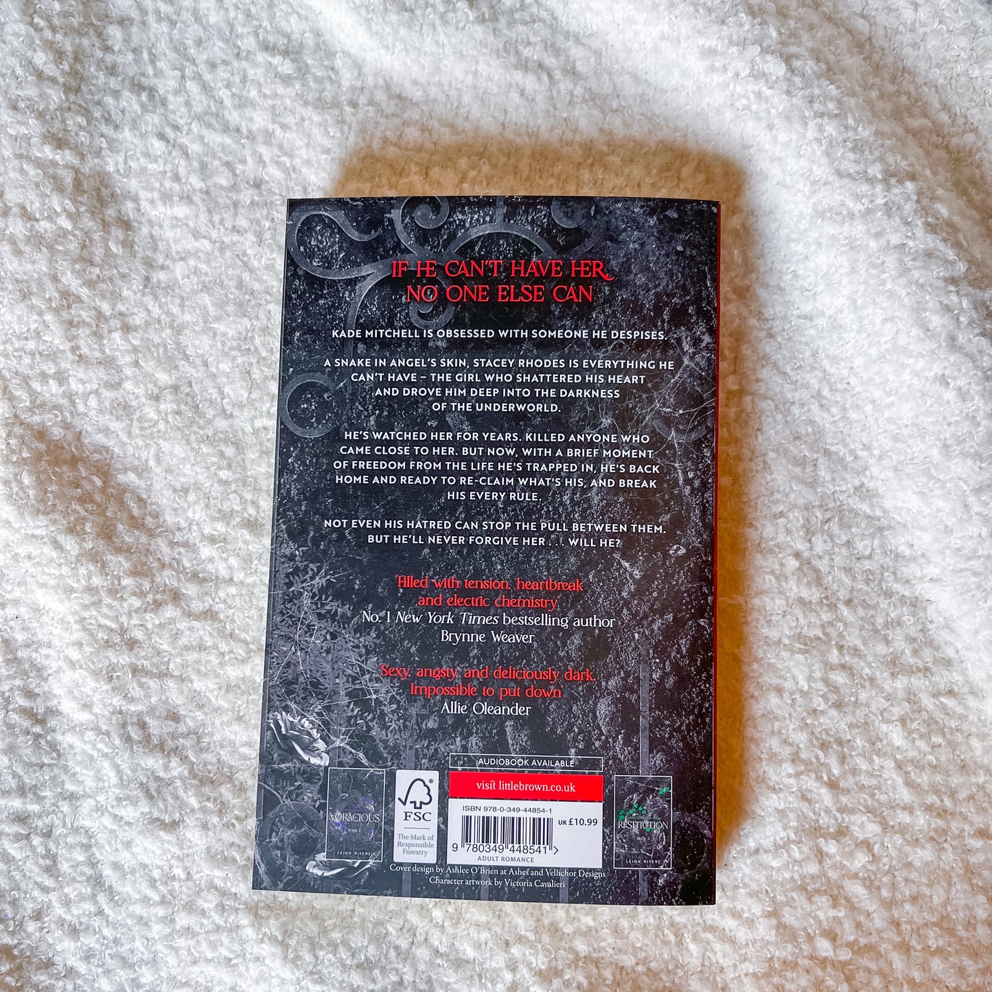 Book back cover with text and a barcode on a textured surface