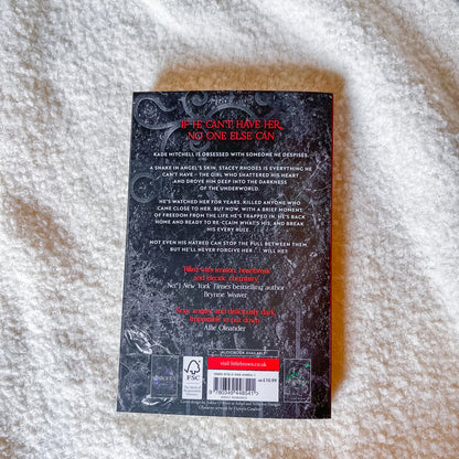 Book back cover with text and a barcode on a textured surface