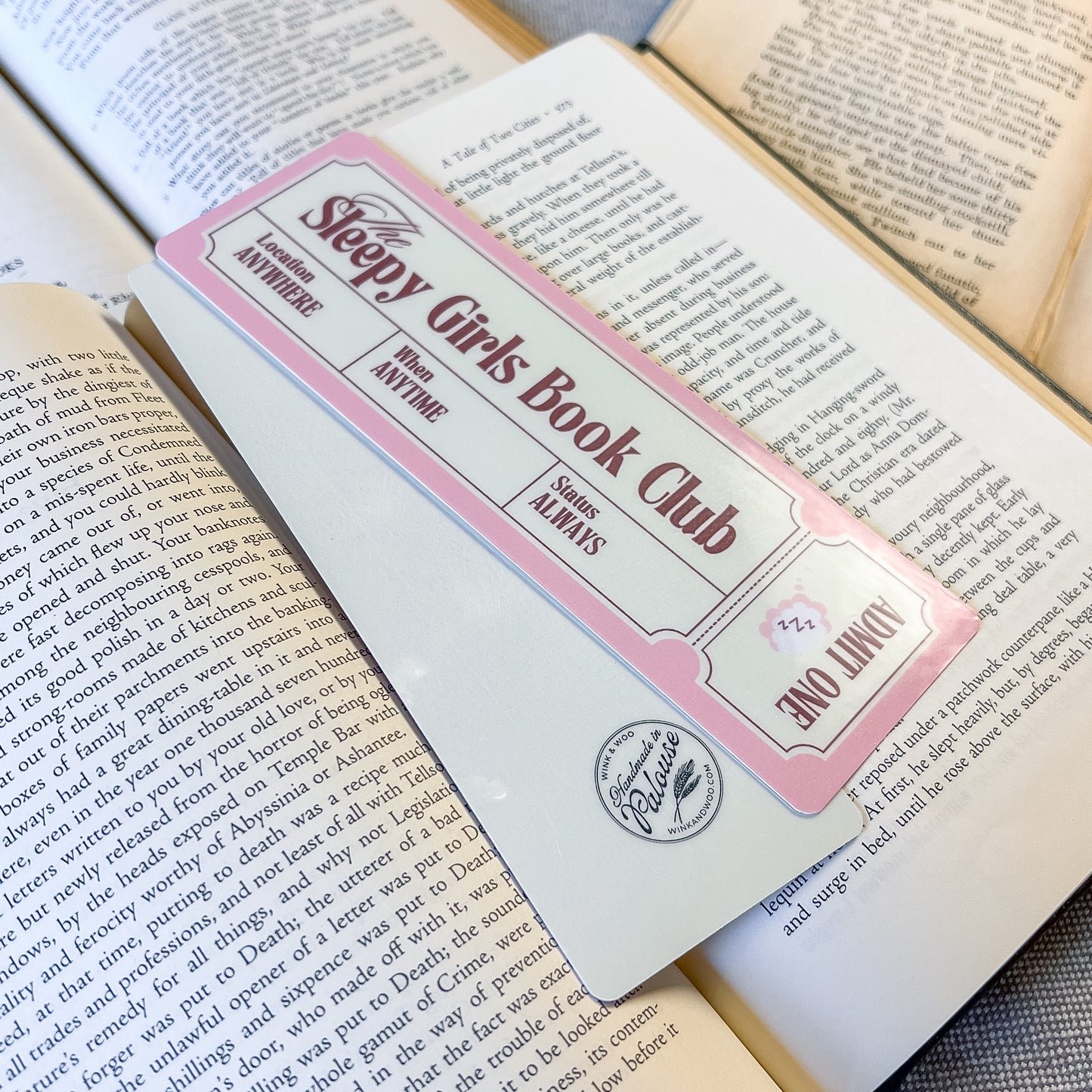 Book with a 'Sleepy Girls Book Club' bookmark on an open book